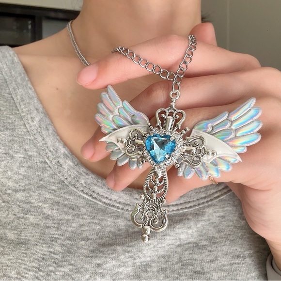 Anthropologie Silver Winged Cross Necklace with Light Blue Heart - Picture 2 of 3